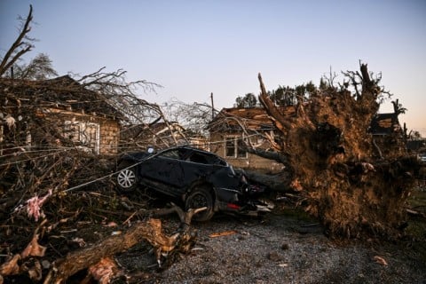 The remains of a house and cars in Rolling Fork, Mississippi, after a tornado devastates the state