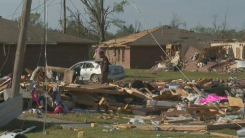 The remains of crushed house and cars in Rolling Fork, Mississippi after a tornado touched down in the area