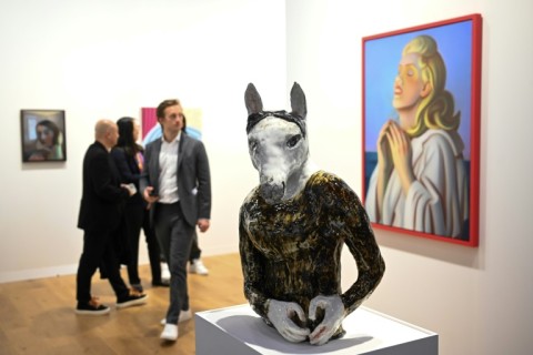 Visitors look at "Horse With A Heart" by Czech artist Klara Kristalova at Hong Kong's Art Basel