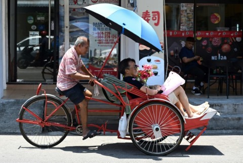 There are just over 130 trishaws in Penang where the handlers pedal from behind their patrons