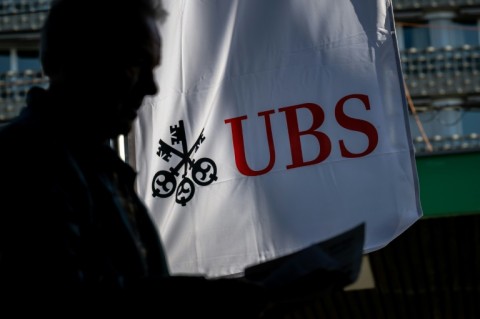 A UBS shareholder arrives for the bank's annual general meeting in Basel