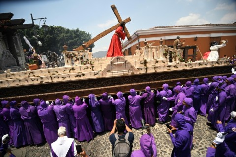 Guatemalan Catholic devotees take part in a procession in the tourist city of Antigua during Easter celebrations