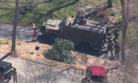 A screen grab shows law enforcement taking into custody Jack Teixeira -- suspected of being behind a major leak of classified US documents