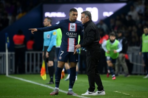 Kylian Mbappe talks to PSG coach Christophe Galtier during the Ligue 1 leaders' match against Lens on Saturday
