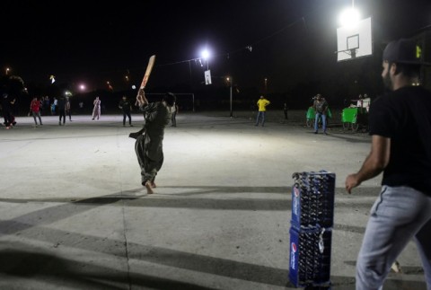 Matches played in the poorest neighbourhoods can draw hundreds of spectators, with many onlookers admitting that watching cricket all night helps with the day's fast