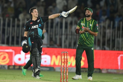 New Zealand's Mark Chapman (L) celebrates after scoring a century