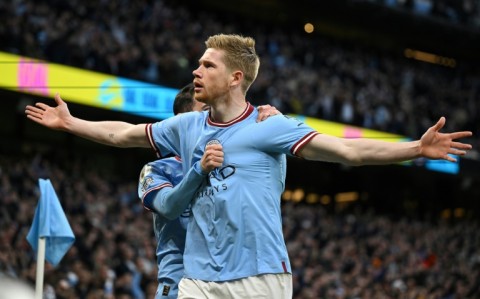 Demolition man: Manchester City's Kevin De Bruyne celebrates scoring against Arsenal