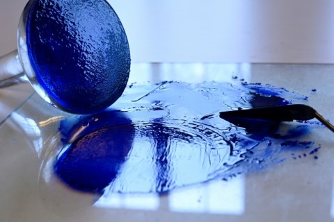 At Amsterdam's Rijksmuseum, art lecturer Peter Pelkmans prepares a paste of lapis lazuli and linseed oil to make ultramarine blue paint