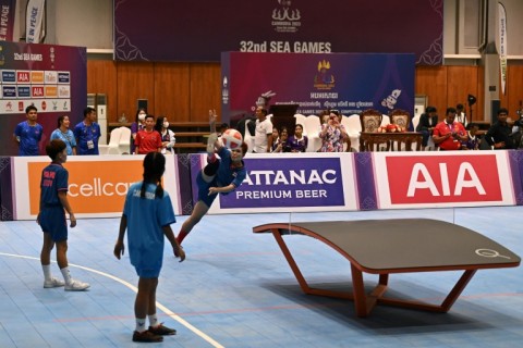 Played on a curved table, it melds elements of football, volleyball and ping-pong
