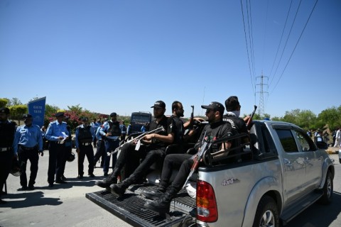 Police stand guard near the police headquarters in Islamabad where Imran Khan was being kept in custody