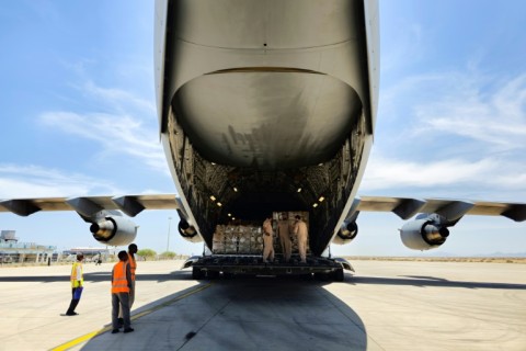 Workers unload aid supplies from an Emirati aircraft at Port Sudan airport on May 10, 2023, as violence between two rival Sudanese generals continues