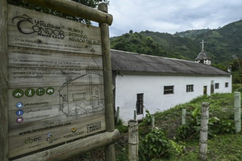 View of a sign telling the story of the church of the Rio Calro village which survived the last major eruption of the Nevado del Ruiz volcano in 1985, in Villamaria, Colombia