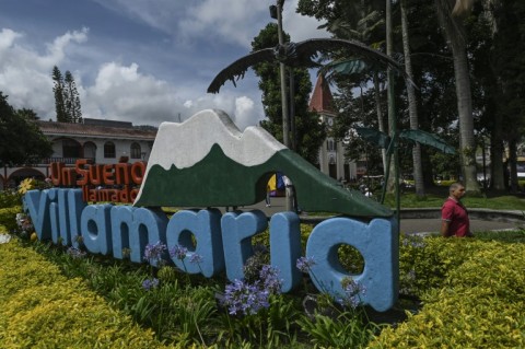 A man walks in the main square of Villamaria, Colombia