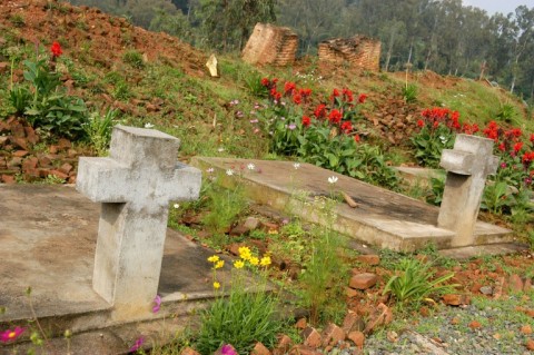A 2004 file picture showing a mass grave and the ruins of the Notre Dame de la Visitation church in Nyange where 2,000 Tutsis were slaughtered 