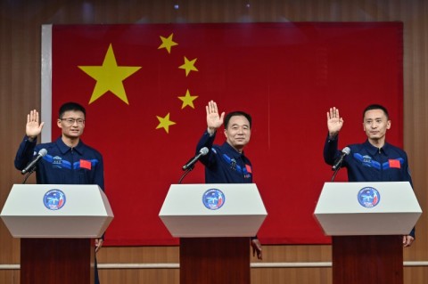 Gui Haichao (L) is the first Chinese civilian in space, and will be accompanied by mission commander Jing Haipeng (C) and space flight engineer Zhu Yangzhu
