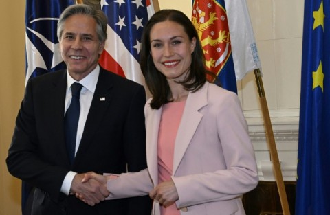 US Secretary of State Antony Blinken  and Finnish Prime Minister Sanna Marin shake hands as they meet in Helsinki where he delivered a speech on the Ukraine war