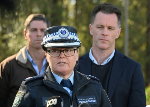 The driver was arrested but no charges have been laid so far, said Acting Assistant Commissioner Tracy Chapman (C, with NSW Premier Chris Minns, R) 
