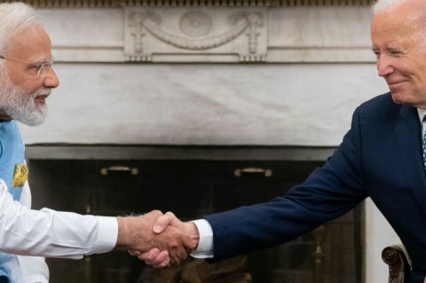 US President Joe Biden shakes hands with India's Prime Minister Narendra Modi in the Oval Office of the White House 