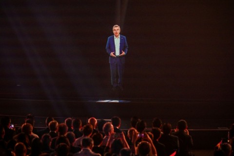 A projection of Thomas Bach, president of International Olympic Committee, delivers a speech during the opening ceremony of the Olympic Esports Week in Singapore 