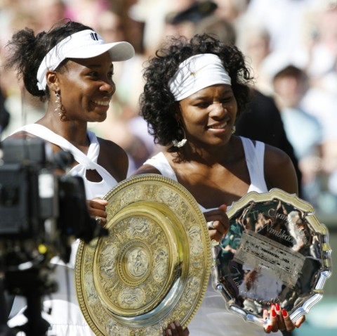 Family ties: Venus Williams with sister  Serena after winning the 2008 Wimbledon final 