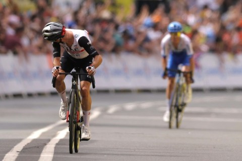 Adam Yates (L) glances back at twin Simon as they near the Bilbao finish line at the end of the opening stage of the Tour de France
