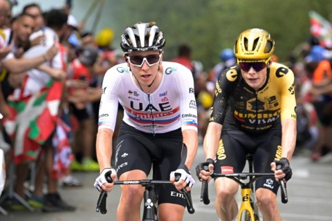 Tadej Pogacar (L) tailed by defending champion Jonas Vingegaard on stage one of the Tour de France