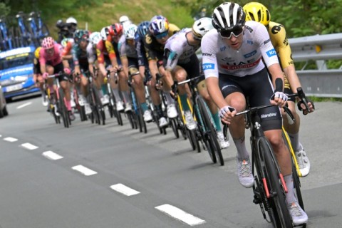 Tadej Pogacar riding downhill at the head of the lead clique 