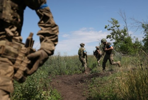 Ukrainian servicemen of the 22th mechanized brigade operate at a recaptured position near the village of Klyshchiivka south of Bakhmut 