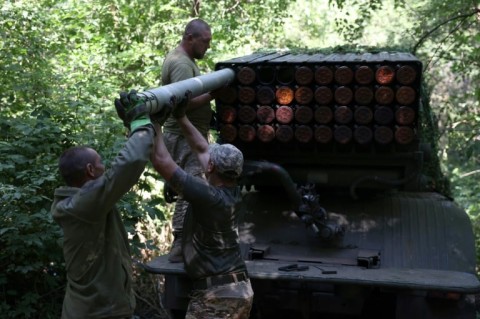 Ukrainian artillerymen operate a BM-21 "Grad" rocket launcher near Bakhmut 