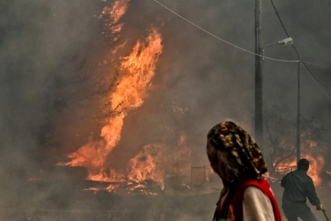 Local residents watch raging wildfires in Greece