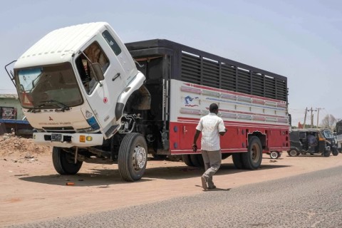 Parked lorries in their hundreds line the road connecting Sudan's capital to Al-Jazirah state