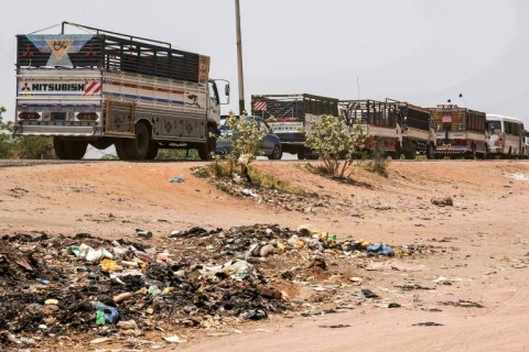 Parked lorries in their hundreds line the road connecting Sudan's capital to Al-Jazirah state