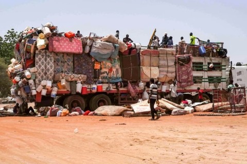 A truck carrying mattresses and pieces of furniture parked along the road connecting Sudan's capital to the city of Wad Madani