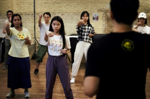 Mic Leung (R) teaches students Wing Chun, the martial art studied by Bruce Lee before he developed his own system