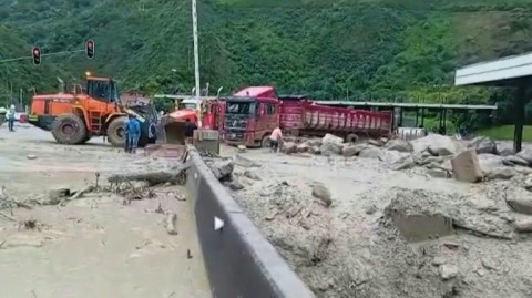 Aftermath of a landslide triggered by heavy rains that left multiple people dead