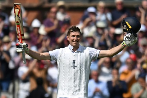 Ton of joy: England's Zak Crawley celebrates his hundred in the fourth Ashes Test at Old Trafford