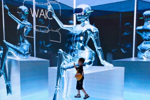 A child visits the World Artificial Intelligence Conference (WAIC) in Shanghai. AFP/Wang Zhao