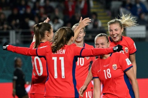 Norway players celebrate the fourth goal in their rout of the Philippines