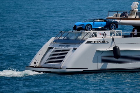 A Bugatti Chiron super car is parked on the stern of a yacht entering the Monte Carlo harbour. AFP/Andrej Isakovic