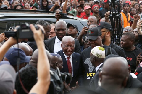 Economic Freedom Fighters (EFF) leader Julius Malema (C) arrives at the KuGompo City Regional court in East London on April 15, 2026 for his sentencing for firing an assault rifle at a rally eight years ago.