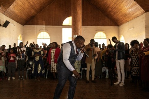 A pastor of the Apostolic Faith Mission addresses the congregation at Harare's Gospel Fire Cathedral