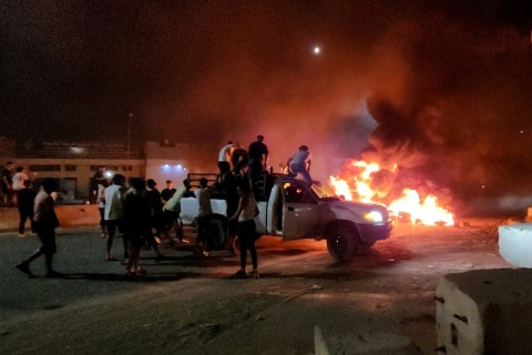 Libyans burn tyres as they protest in Tripoli