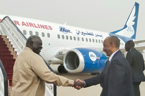 Sudan's army chief Abdel Fattah al-Burhan prepares to board a plane to Egypt on his first visit abroad since fighting flared in April with a rival general 