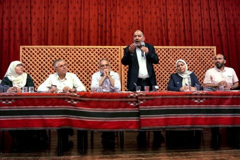 Tayseer Abu Sneineh, mayor of the occupied West Bank city of Hebron, discusses water shortages during a session at the municipality hall