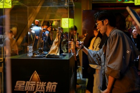 A Star Trek fan takes pictures during mainland China's first official fandom event for science-fiction adventure franchise in Beijing