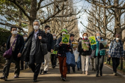 People take part in a protest earlier this year against the redeveopment of a rare green area in central Tokyo