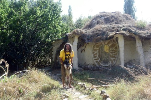 Ackov and his dog outside his home near Veles in North Macedonia 
