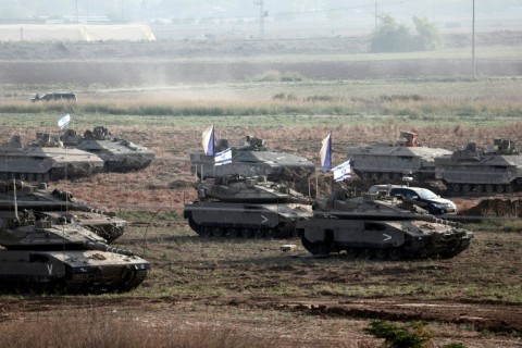 Thousands of Israeli troops and heavy weaponry are amassed on the border with Gaza