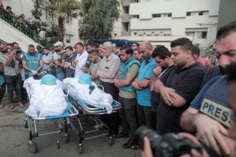 Mourners attend the funeral of fellow journalists Said al-Taweel and Mohammed Sobboh, who were killed in an Israeli airstrike on Gaza City 