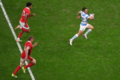 Argentina fly-half Nicolas Sanchez (right) streaks clear to score the match-clinching try in the World Cup quarter-final against Wales